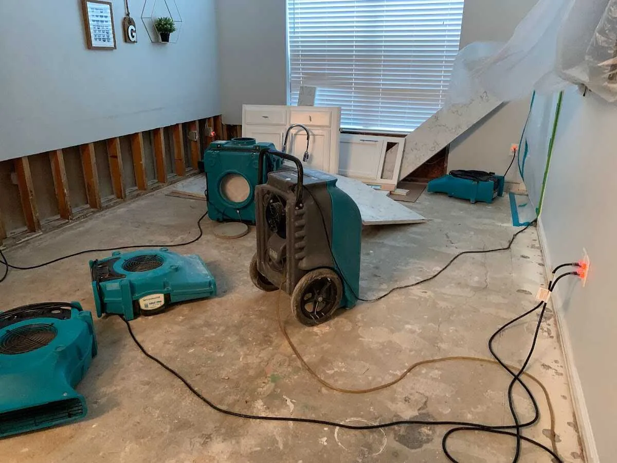 Dehumidifier in flood-cut room for Water Damage Restoration in Westchase